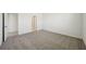 Spacious carpeted bedroom with neutral tones and abundant natural light from windows at 1859 Draughton Dr, Zephyrhills, FL 33541
