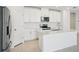 Well-appointed kitchen featuring quartz countertops, stainless steel appliances, and ample cabinet space at 1859 Draughton Dr, Zephyrhills, FL 33541