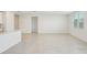 Bright living space featuring tile floors, a large window, and neutral walls at 1859 Draughton Dr, Zephyrhills, FL 33541