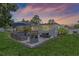 Outdoor entertaining area with seating, a grill, and a spacious patio for social gatherings at 2110 W Farwell Dr, Tampa, FL 33603