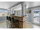 Features a tile-accented wet bar with counter seating and lots of natural light at 2110 W Farwell Dr, Tampa, FL 33603