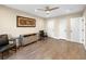 Large bedroom featuring hardwood floors and multiple closets at 2110 W Farwell Dr, Tampa, FL 33603