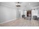 Spacious bedroom with modern lighting, wood-look floors, and barn door closet, perfect for creating a relaxing retreat at 2110 W Farwell Dr, Tampa, FL 33603