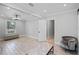 Bedroom with hardwood floors and chair with window at 2110 W Farwell Dr, Tampa, FL 33603