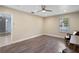 Neutral bedroom with hardwood floors, window and ceiling fan at 2110 W Farwell Dr, Tampa, FL 33603