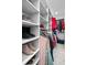 Organized walk-in closet with shelving and hanging space for efficient storage of clothing and accessories at 2110 W Farwell Dr, Tampa, FL 33603