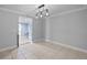 Open dining area with neutral tile flooring and modern pendant lighting, ready for personalized decor and gatherings at 2110 W Farwell Dr, Tampa, FL 33603