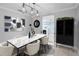 Elegant dining room with stylish decor, marble table, and modern lighting for sophisticated meals and gatherings at 2110 W Farwell Dr, Tampa, FL 33603