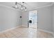 Neutral dining room featuring chandelier and tile flooring at 2110 W Farwell Dr, Tampa, FL 33603