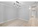 Dining room featuring chandelier and neutral coloring at 2110 W Farwell Dr, Tampa, FL 33603