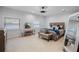 Comfortable bedroom with plush carpeting, ample natural light, and stylish furnishings at 2110 W Farwell Dr, Tampa, FL 33603