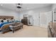 Spacious bedroom with contemporary decor, plush bed, and dresser at 2110 W Farwell Dr, Tampa, FL 33603