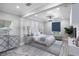 Staged primary bedroom features light hardwood floors and stylish decor at 2110 W Farwell Dr, Tampa, FL 33603