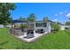 Outdoor patio featuring a grill and ample seating space, ideal for entertaining and enjoying the outdoors at 2110 W Farwell Dr, Tampa, FL 33603