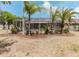 Screened-in patio area surrounded by lush landscaping, offering a private outdoor space at 2707 Wood Pointe Dr, Holiday, FL 34691