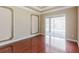 A bedroom with a beautiful view of the backyard and an outdoor patio, showcasing the room's openness and natural light at 2707 Wood Pointe Dr, Holiday, FL 34691