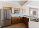 Functional kitchen equipped with modern appliances and ample cabinetry, ready for culinary creations at 2707 Wood Pointe Dr, Holiday, FL 34691