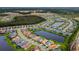 Aerial view of a community featuring homes surrounding a lake and green spaces at 32740 Tree Of Life Ave, Wesley Chapel, FL 33543