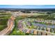 Wide aerial shot showing the location of the house, lake, construction, and surrounding neighborhoods at 32740 Tree Of Life Ave, Wesley Chapel, FL 33543