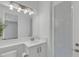 Well-lit bathroom features a white vanity, modern fixtures, and a glass-enclosed shower at 32740 Tree Of Life Ave, Wesley Chapel, FL 33543