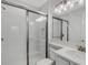 Modern bathroom featuring white subway tile shower, sleek fixtures, and ample vanity space at 32740 Tree Of Life Ave, Wesley Chapel, FL 33543