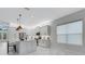 Bright kitchen with white cabinets, stainless appliances, large center island and tile floors at 32740 Tree Of Life Ave, Wesley Chapel, FL 33543
