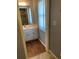 Bathroom featuring wood look floors and a single vanity with a white countertop at 420 S Brockfield Dr, Sun City Center, FL 33573