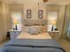 Tranquil bedroom with a comfortable bed, nightstands, and lamps at 420 S Brockfield Dr, Sun City Center, FL 33573