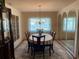 Charming dining room with table set for six and a chandelier at 420 S Brockfield Dr, Sun City Center, FL 33573
