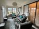 Inviting Florida room with comfortable seating, stylish decor, and access to the outdoors at 420 S Brockfield Dr, Sun City Center, FL 33573