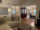 Inviting living room showcasing hardwood floors, modern furnishings, and dining room at 420 S Brockfield Dr, Sun City Center, FL 33573