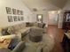 Cozy living room featuring a large sectional sofa, decor, and hardwood floors at 420 S Brockfield Dr, Sun City Center, FL 33573