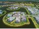 Stunning aerial view of waterfront homes with private pools in a picturesque community setting at 4754 Manning Ct, Sarasota, FL 34240