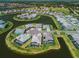 Stunning aerial view of waterfront homes with private pools in a picturesque community setting at 4754 Manning Ct, Sarasota, FL 34240