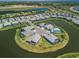 Aerial view showcasing waterfront homes with lush landscaping in a serene and upscale neighborhood at 4754 Manning Ct, Sarasota, FL 34240