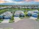 Beautiful aerial view of luxury homes in an upscale community with a lake in the background at 4754 Manning Ct, Sarasota, FL 34240