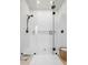 Modern walk-in shower featuring sleek glass enclosure and stylish fixtures, offering a spa-like experience at 4754 Manning Ct, Sarasota, FL 34240