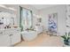 Bright bathroom showcasing double vanities, a freestanding tub, and a serene ambiance at 4754 Manning Ct, Sarasota, FL 34240