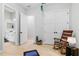 Bright flex space featuring wood floors, and doorway view into the bathroom at 4754 Manning Ct, Sarasota, FL 34240
