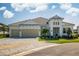 Beautiful single-story home with a two-car garage, neutral color scheme, and manicured landscaping at 4754 Manning Ct, Sarasota, FL 34240