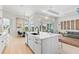 Bright, open kitchen with a large island, stainless steel appliances, and seamless flow to the living area at 4754 Manning Ct, Sarasota, FL 34240