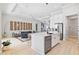 Bright, open kitchen featuring a large island, stainless steel appliances, and seamless connection to the living area at 4754 Manning Ct, Sarasota, FL 34240