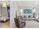Open floor plan with cozy living room featuring modern decor and connection to the bedroom at 4754 Manning Ct, Sarasota, FL 34240