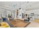 Spacious living area with open floor plan showcasing a kitchen, dining space, and decorative light fixtures at 4754 Manning Ct, Sarasota, FL 34240