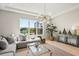 Bright living room with water view, comfortable seating, and modern decor at 4754 Manning Ct, Sarasota, FL 34240