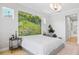 Spacious and bright main bedroom featuring natural light and ample space for relaxation at 4754 Manning Ct, Sarasota, FL 34240