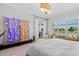 Stylish main bedroom featuring a sliding glass door and a view of the lush, green backyard at 4754 Manning Ct, Sarasota, FL 34240