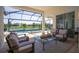 Inviting screened-in patio with comfortable seating, perfect for relaxation and enjoying the outdoor scenery at 4754 Manning Ct, Sarasota, FL 34240