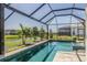 Relaxing screened-in pool with serene water views, perfect for outdoor enjoyment at 4754 Manning Ct, Sarasota, FL 34240
