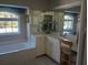Spa-like bathroom with soaking tub, vanity, and large windows offers a luxurious escape at 4875 Hansard Ave, North Port, FL 34286